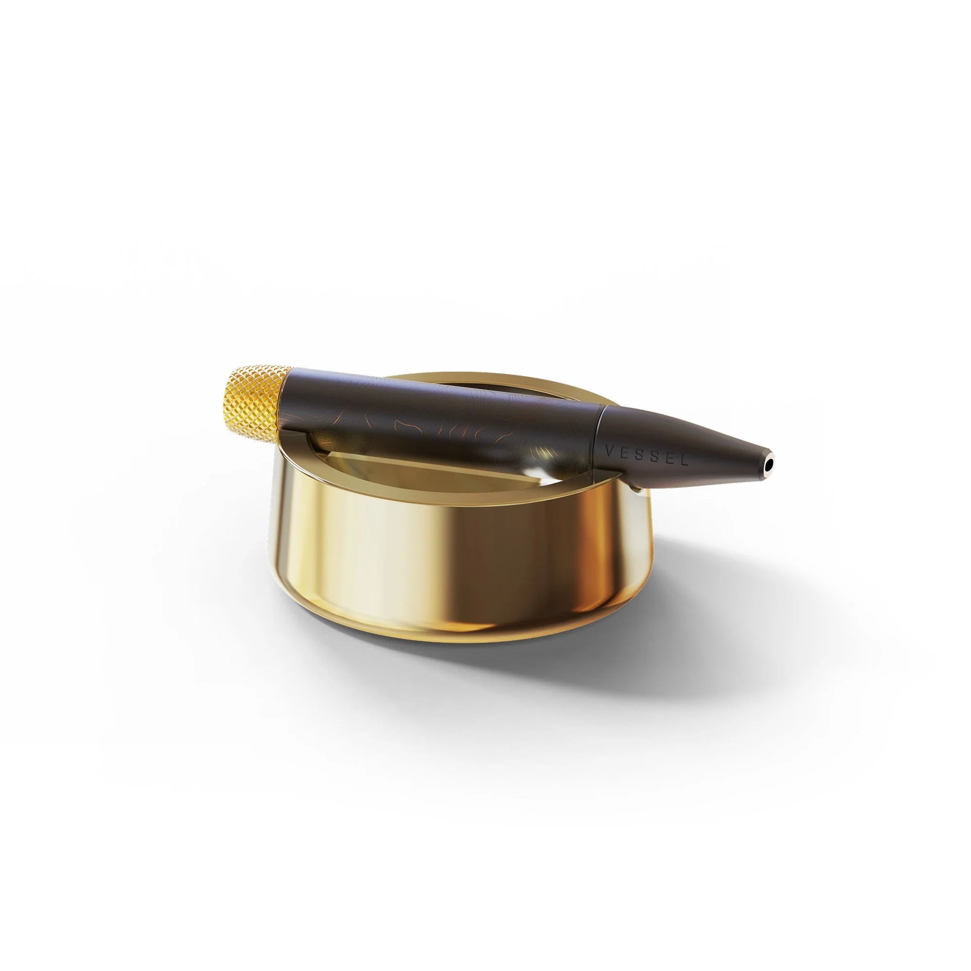 Gold Ahstray with a vessel vape