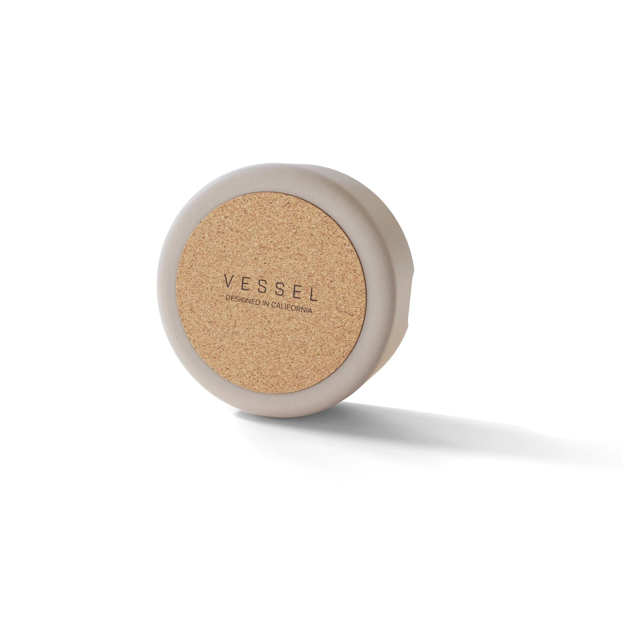 White Ashtray by Vessel from behind